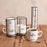 Tour de 4 mugs empilables porcelaine 39 cl - mug fond blanc cassé avec motif noir - tour métal noire - Table Passion
